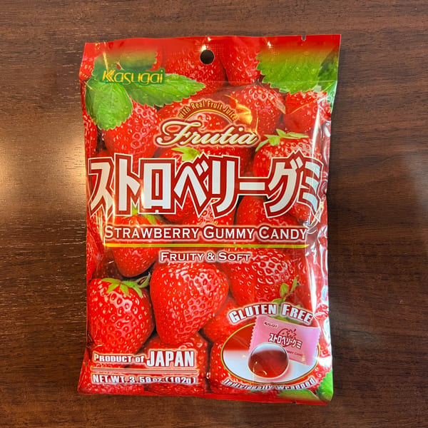 A red bag of Kasugai Frutia Strawberry Gummy Candy, featuring strawberries and Japanese text.