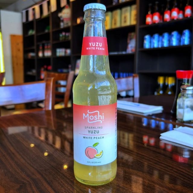 Moshi Sparkling Yuzu White Peach Soda.